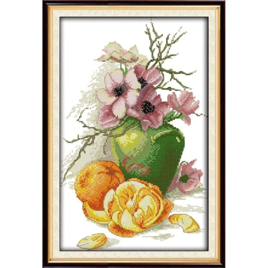 Hibiscus vase and oranges